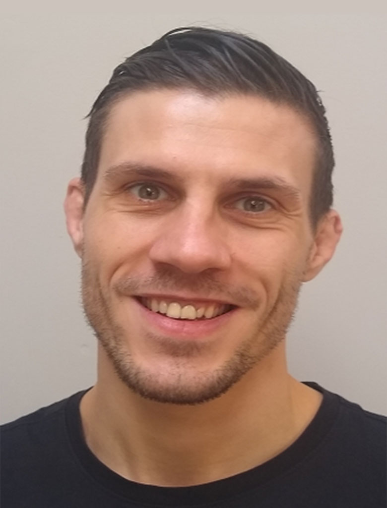 Personal trainer Glenn smiling broadly in a headshot