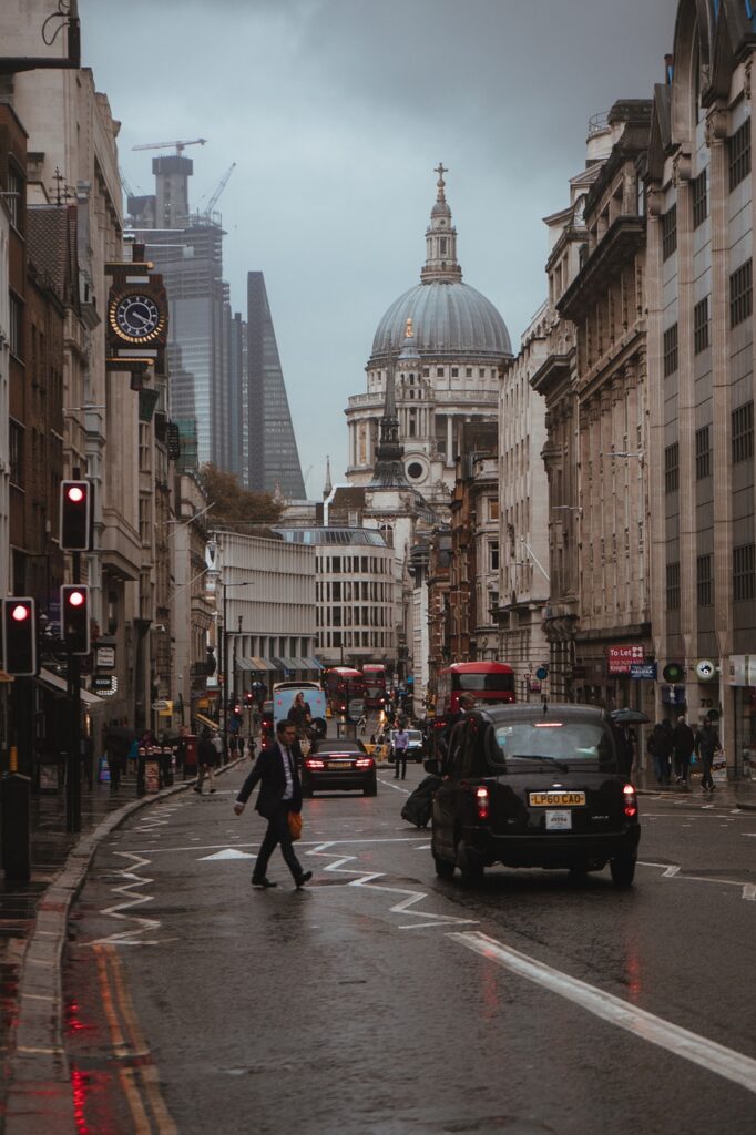 a street in the heart of London city with a black cab and St Paul’s visible in the background, where many aim to lose weight london in their sedentary jobs
