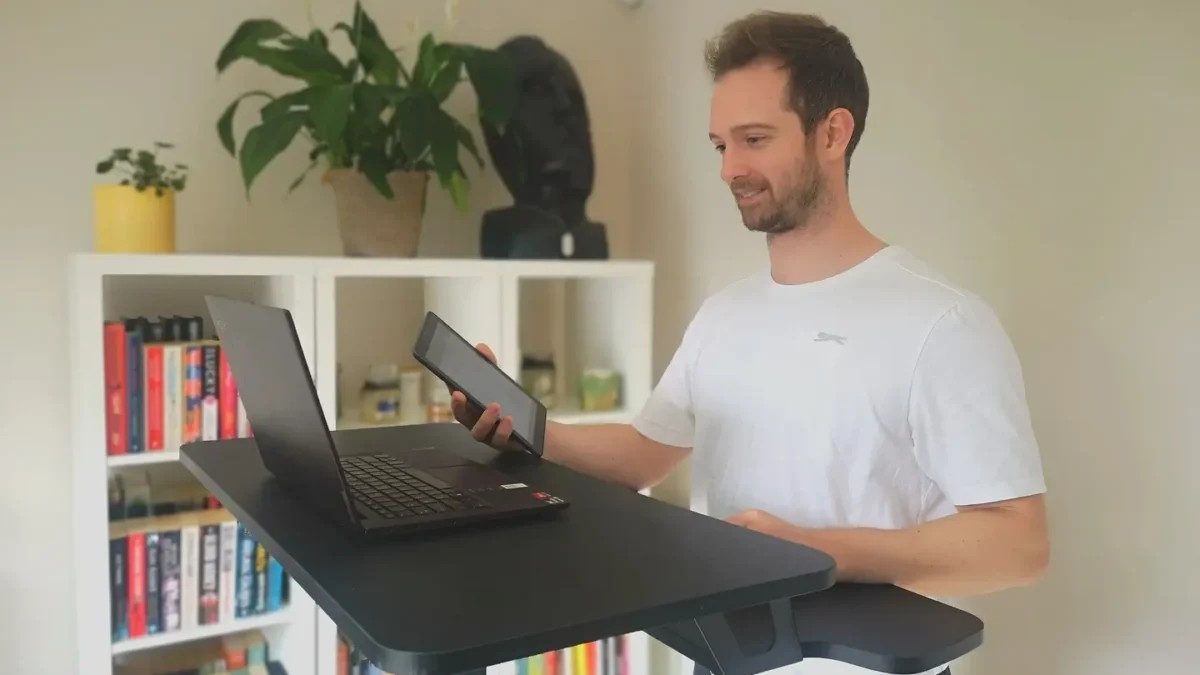 personal trainer delivering a video personal training session on his laptop