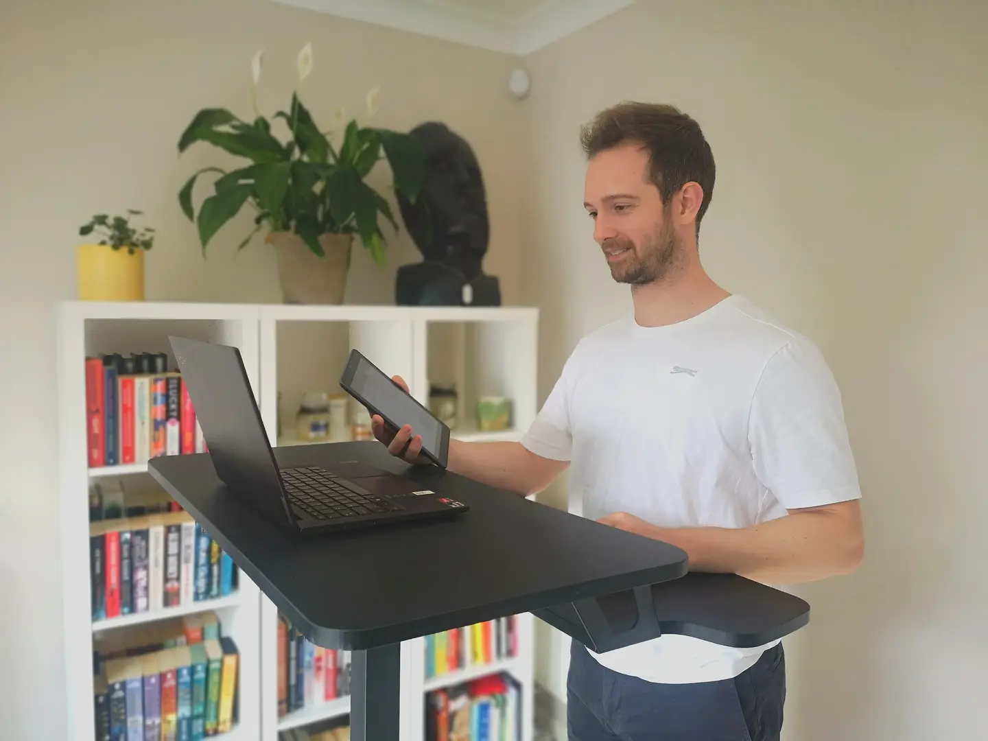 personal trainer delivering a video personal training session on his laptop
